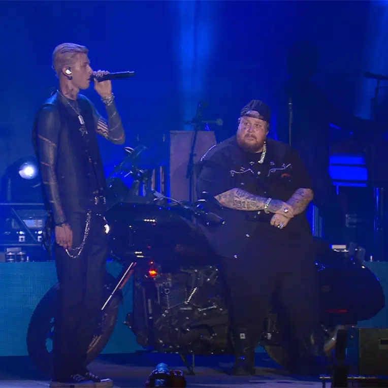 Still from mgk + Jelly Roll's live performance of "Lonely Road."